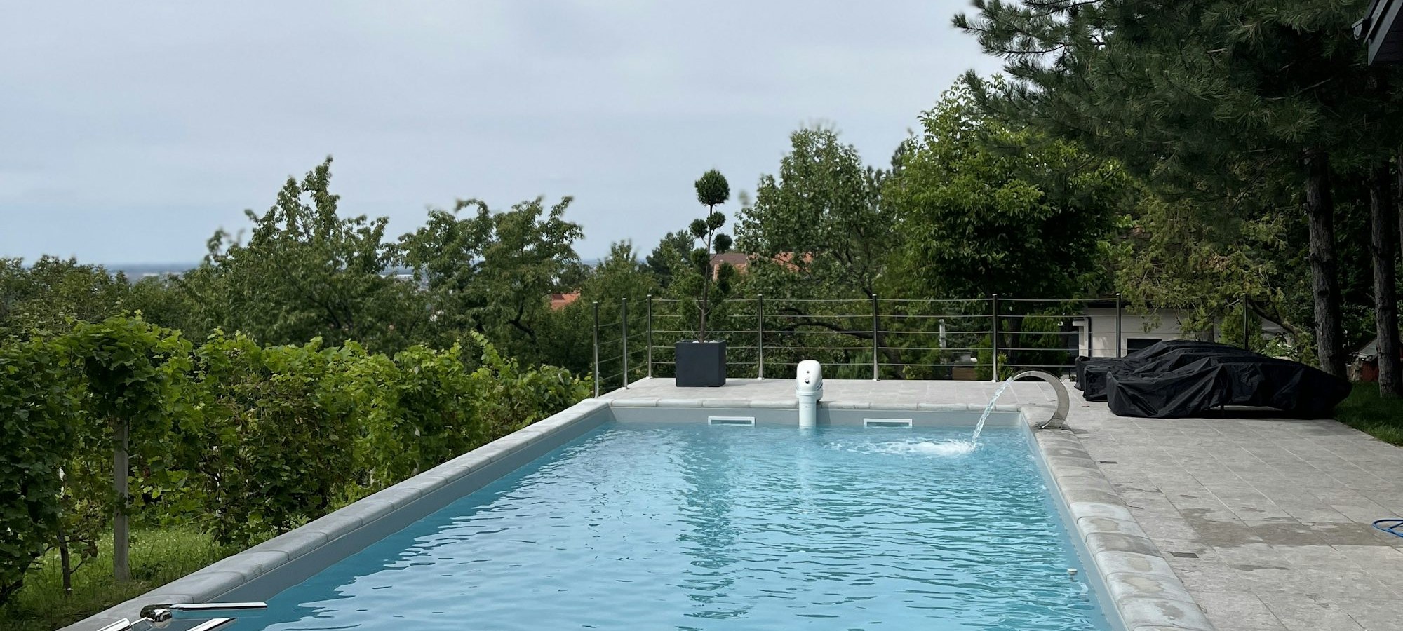 Crystal clear luxury swimming pool with safety barriers